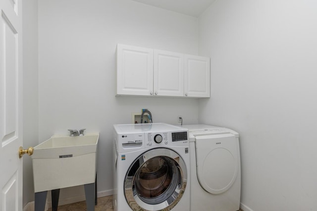 23103 13 Mile Rd, Big Rapids, MI 49307 - laundry room featuring separate washer and dryer and cabinet space