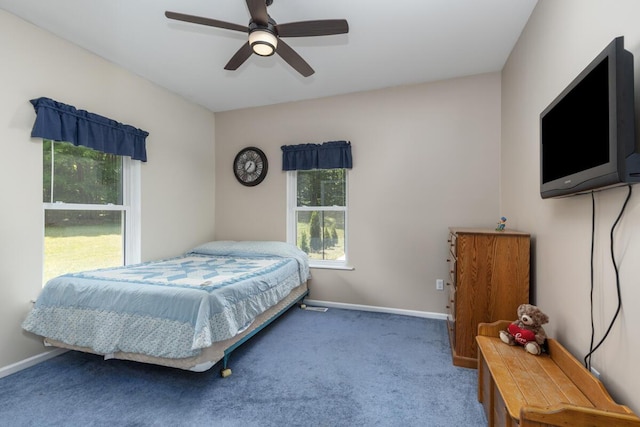 23103 13 Mile Rd, Big Rapids, MI 49307 - carpeted bedroom with baseboards and ceiling fan
