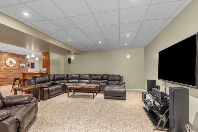 23103 13 Mile Rd, Big Rapids, MI 49307 - living room with carpet, wood walls, a paneled ceiling, and recessed lighting