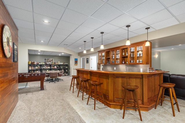 23103 13 Mile Rd, Big Rapids, MI 49307 - indoor wet bar featuring a drop ceiling, hanging light fixtures, and light colored carpet