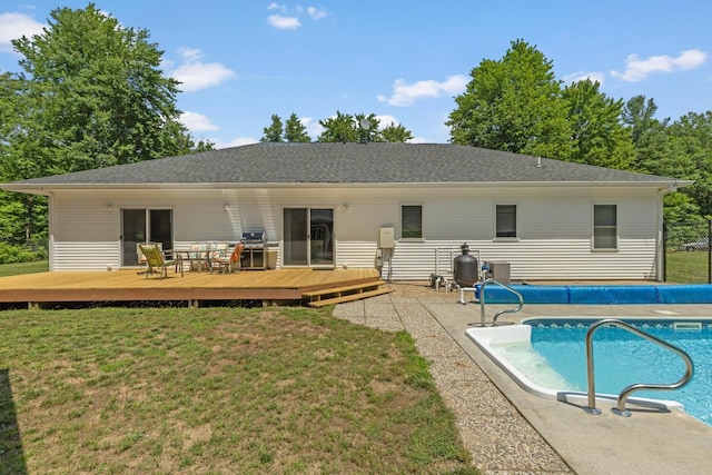 23103 13 Mile Rd, Big Rapids, MI 49307 - back of property with a deck and a covered pool