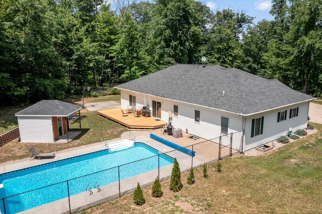 23103 13 Mile Rd, Big Rapids, MI 49307 - view of swimming pool with a wooden deck and an outbuilding