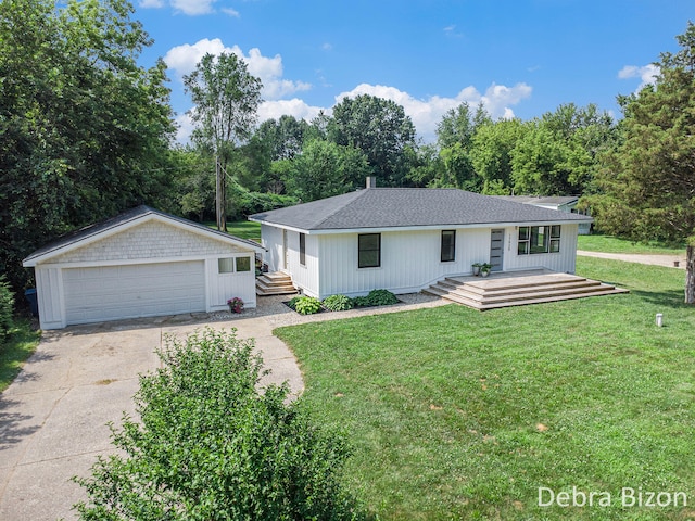 17929 S River Rd, Three Rivers, MI 49093 - view of front of home featuring a garage, a front lawn, a deck, and a shingled roof