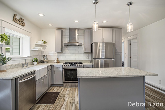17929 S River Rd, Three Rivers, MI 49093 - kitchen featuring wall chimney exhaust hood, stainless steel appliances, gray cabinetry, light wood-type flooring, and open shelves