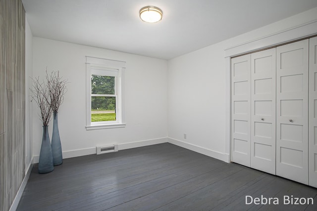 17929 S River Rd, Three Rivers, MI 49093 - unfurnished bedroom with dark wood-style floors and a closet