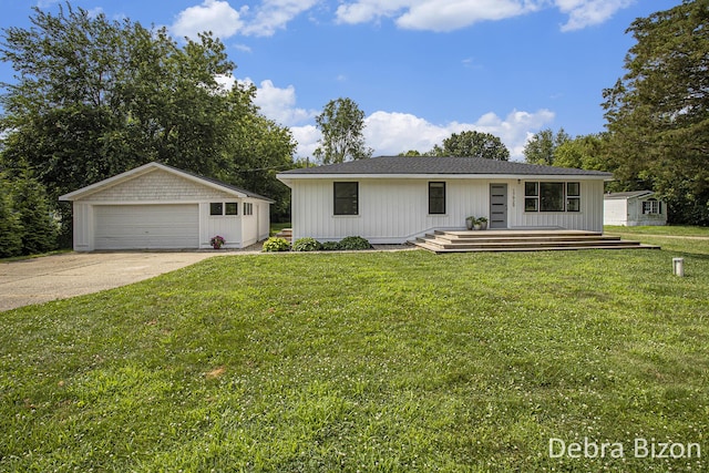 17929 S River Rd, Three Rivers, MI 49093 - view of front of property with an outdoor structure, a detached garage, and a front lawn