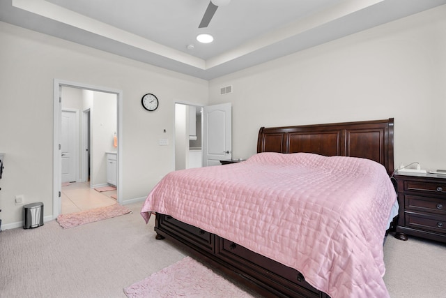 4814 Cranston Rd Unit 86, Canton, MI 48188 - bedroom with light colored carpet, a tray ceiling, ensuite bathroom, and ceiling fan