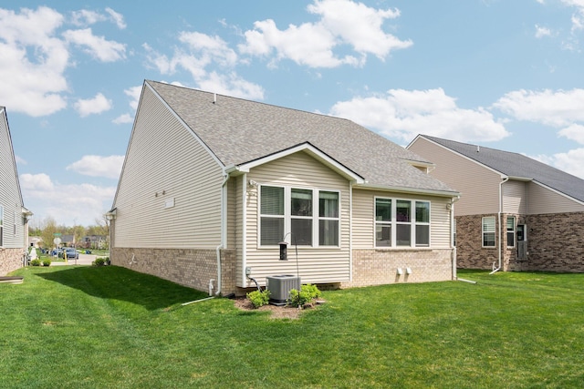 4814 Cranston Rd Unit 86, Canton, MI 48188 - back of property featuring brick siding, a lawn, and a shingled roof