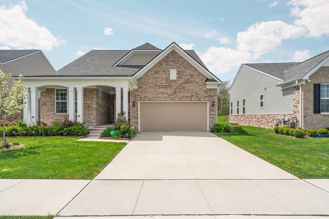 4814 Cranston Rd Unit 86, Canton, MI 48188 - craftsman-style house featuring brick siding, a front yard, driveway, and a garage