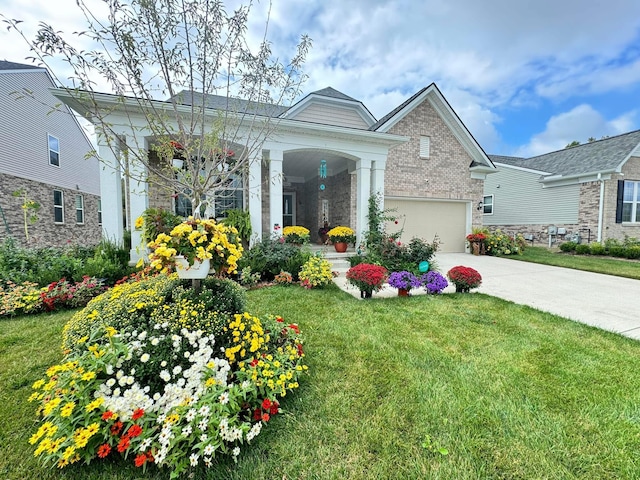 4814 Cranston Rd Unit 86, Canton, MI 48188 - view of front of home featuring a front lawn, driveway, a porch, and brick siding