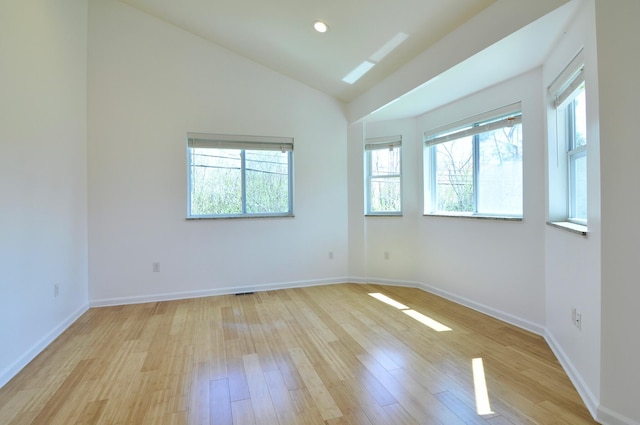 2019 Chalmers Dr, Ann Arbor, MI 48104 - unfurnished room featuring light wood finished floors and vaulted ceiling