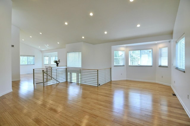 2019 Chalmers Dr, Ann Arbor, MI 48104 - empty room featuring light wood-type flooring, lofted ceiling, and recessed lighting