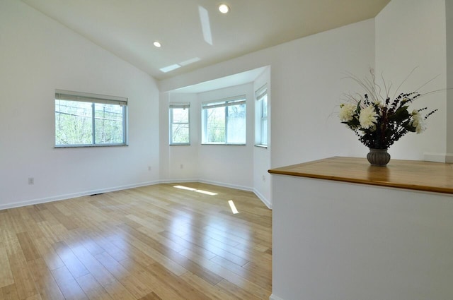 2019 Chalmers Dr, Ann Arbor, MI 48104 - empty room featuring vaulted ceiling, light wood-style floors, and recessed lighting
