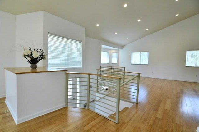 2019 Chalmers Dr, Ann Arbor, MI 48104 - corridor with an upstairs landing, light wood-type flooring, recessed lighting, and high vaulted ceiling