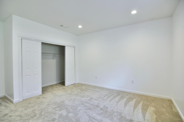 2019 Chalmers Dr, Ann Arbor, MI 48104 - unfurnished bedroom with light colored carpet, recessed lighting, and a closet