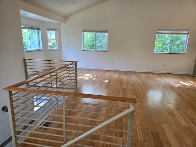 2019 Chalmers Dr, Ann Arbor, MI 48104 - empty room with wood-type flooring and vaulted ceiling