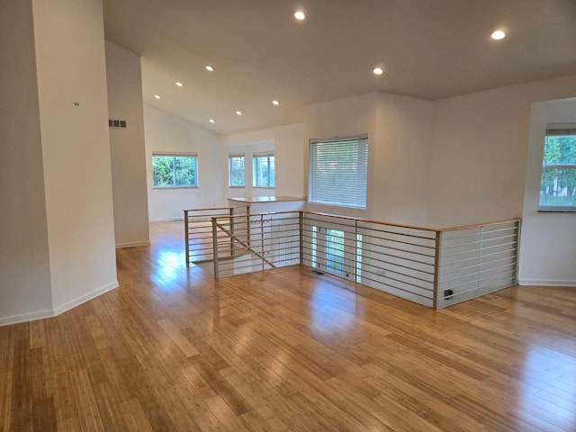 2019 Chalmers Dr, Ann Arbor, MI 48104 - empty room with wood finished floors, recessed lighting, and vaulted ceiling