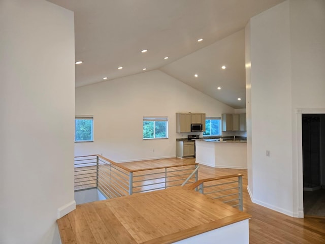 2019 Chalmers Dr, Ann Arbor, MI 48104 - dining area featuring high vaulted ceiling, healthy amount of natural light, light wood finished floors, and recessed lighting