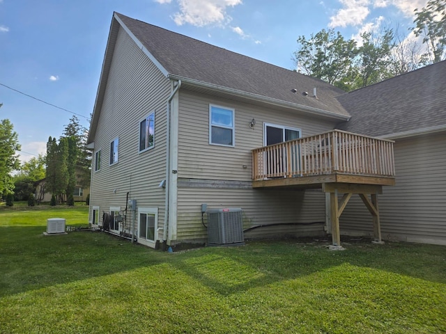 2019 Chalmers Dr, Ann Arbor, MI 48104 - back of house featuring a wooden deck, a yard, and roof with shingles