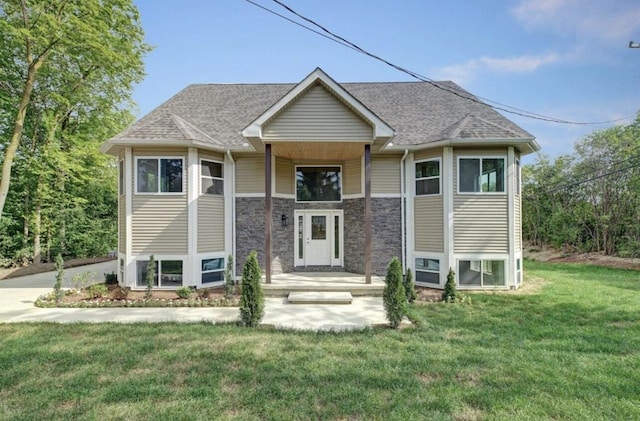2019 Chalmers Dr, Ann Arbor, MI 48104 - bi-level home featuring a front yard and roof with shingles