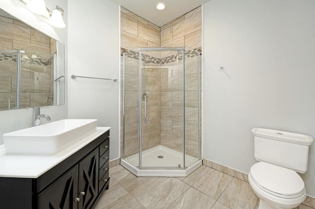 2019 Chalmers Dr, Ann Arbor, MI 48104 - bathroom featuring vanity, a shower stall, and recessed lighting