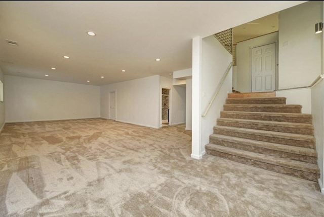 2019 Chalmers Dr, Ann Arbor, MI 48104 - finished below grade area featuring light carpet, recessed lighting, and stairway