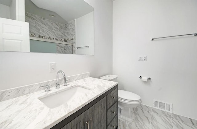 2019 Chalmers Dr, Ann Arbor, MI 48104 - bathroom with vanity, marble finish flooring, and a shower
