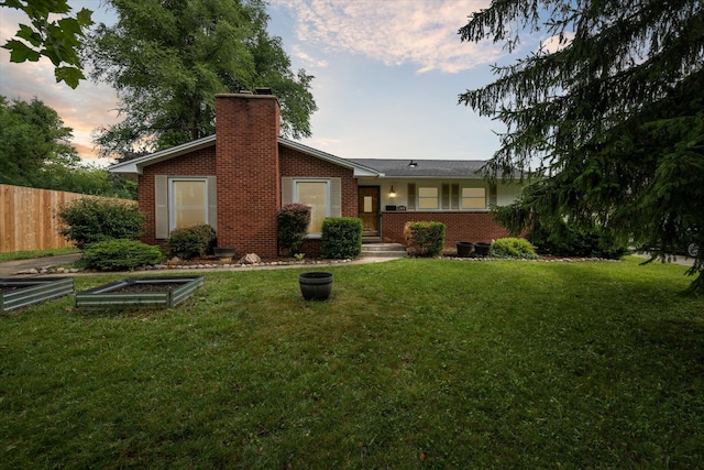 2010 Brampton Ct, Ann Arbor, MI 48103 - rear view of property with a chimney, brick siding, and a garden