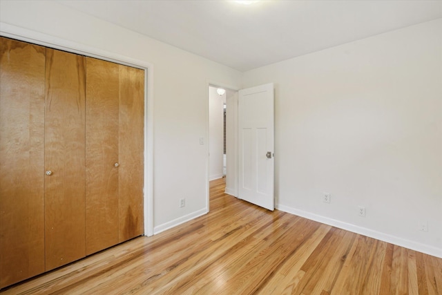 2010 Brampton Ct, Ann Arbor, MI 48103 - unfurnished bedroom with light wood-type flooring and a closet