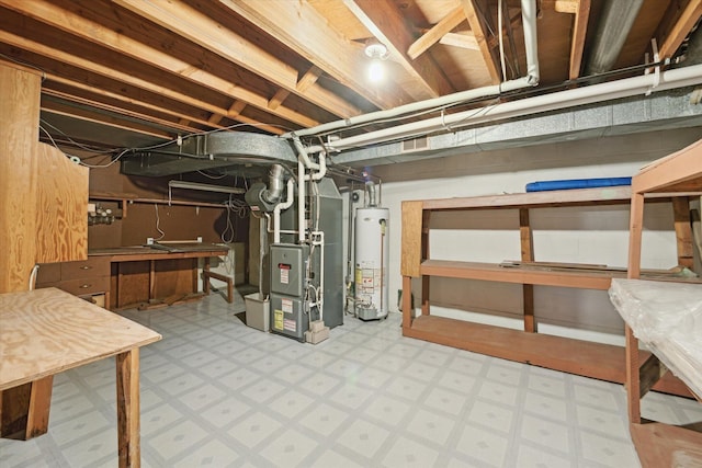 2010 Brampton Ct, Ann Arbor, MI 48103 - unfinished basement featuring gas water heater, tile patterned floors, and heating unit