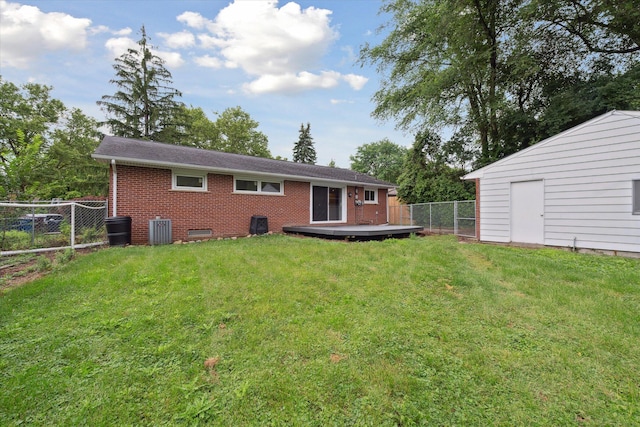 2010 Brampton Ct, Ann Arbor, MI 48103 - rear view of house featuring brick siding, a fenced backyard, and a wooden deck