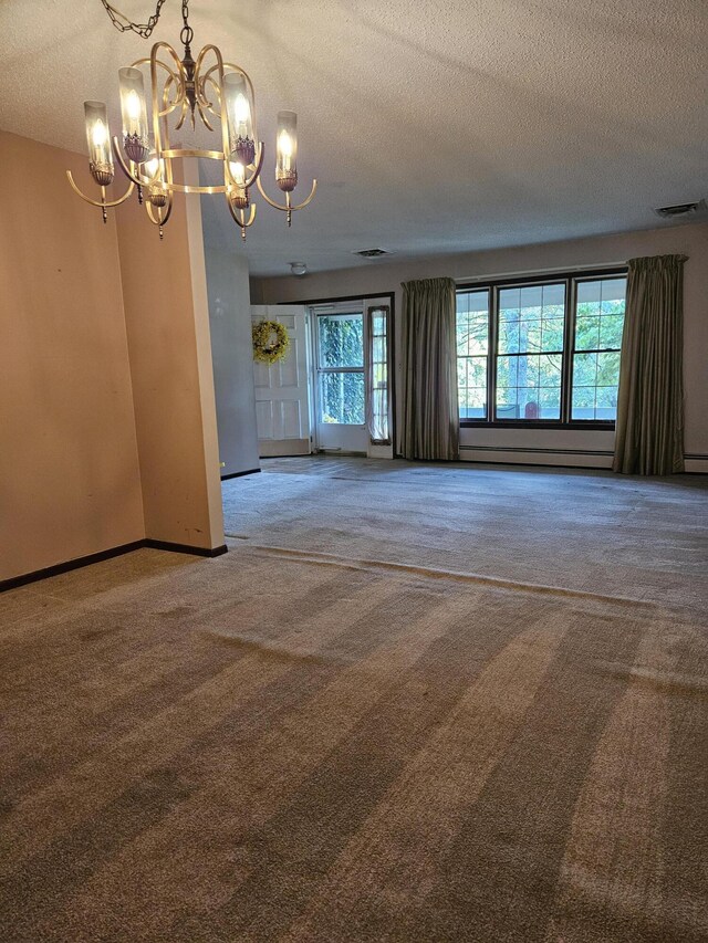 4810 Grandview Dr, Ypsilanti, MI 48197 - empty room featuring a chandelier, carpet flooring, a textured ceiling, and a baseboard heating unit