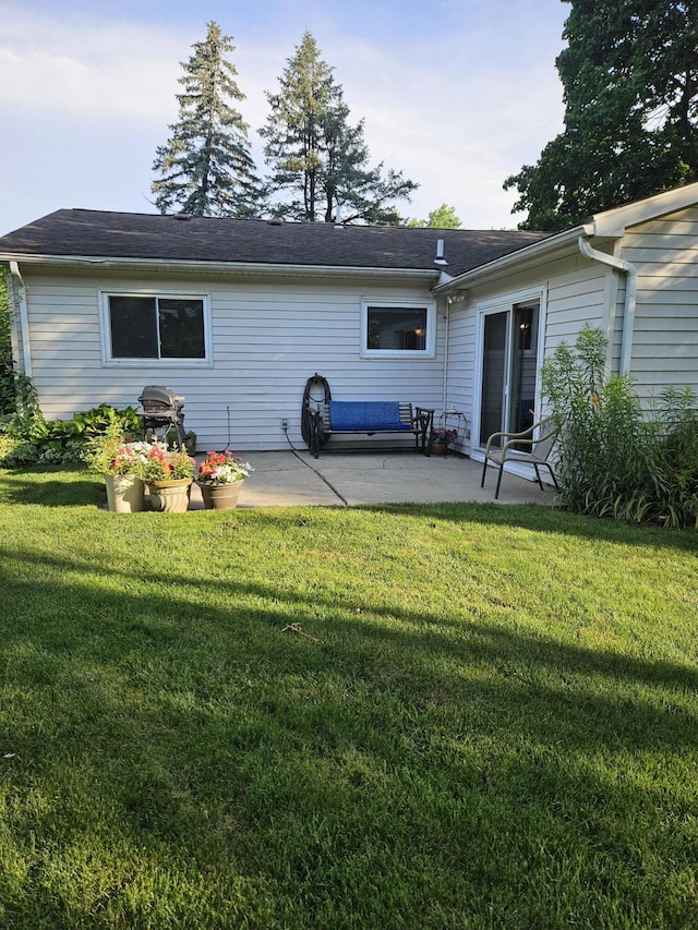 4810 Grandview Dr, Ypsilanti, MI 48197 - rear view of house with a patio area and a lawn