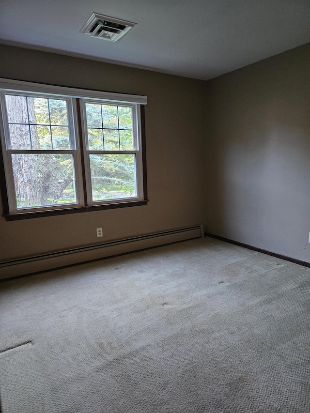 4810 Grandview Dr, Ypsilanti, MI 48197 - empty room with baseboard heating and light colored carpet
