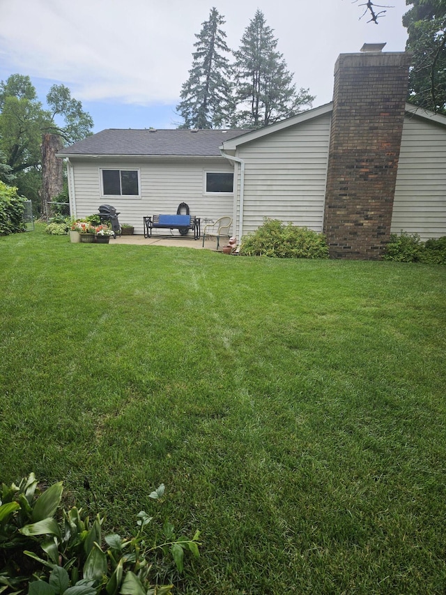 4810 Grandview Dr, Ypsilanti, MI 48197 - rear view of property with a patio and a chimney