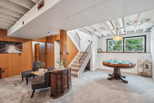 3110 Hilltop Dr, Ann Arbor, MI 48103 - recreation room with wood walls, carpet, and beam ceiling