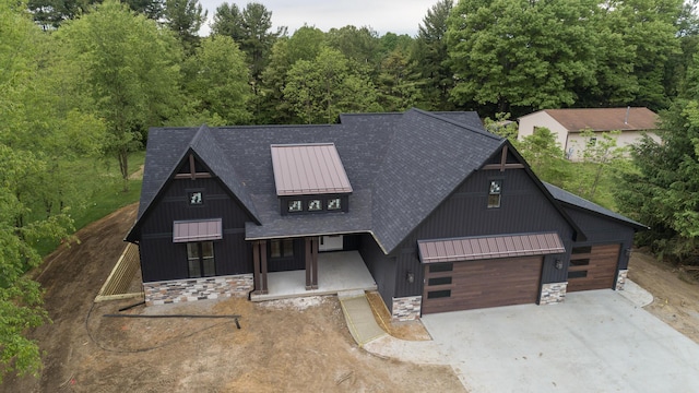 1717 Toscana St, Kalamazoo, MI 49009 - view of front of property featuring driveway, a standing seam roof, and a metal roof
