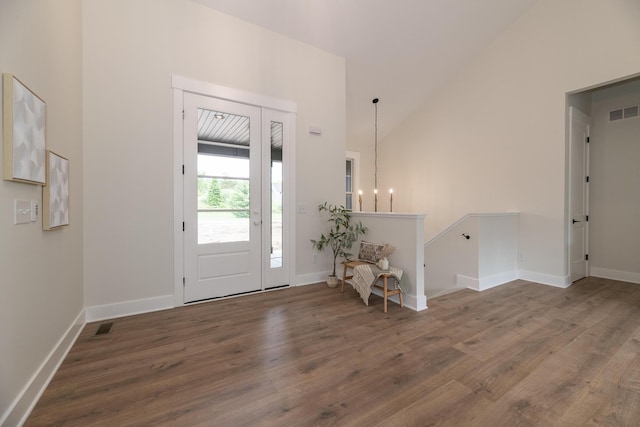 1717 Toscana St, Kalamazoo, MI 49009 - entryway featuring wood finished floors, high vaulted ceiling, and a chandelier