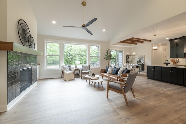 1717 Toscana St, Kalamazoo, MI 49009 - living area with plenty of natural light, a ceiling fan, a fireplace, recessed lighting, and light wood-style floors