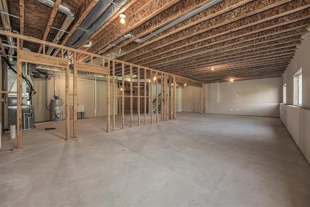 8275 Woodhaven Dr SW, Byron Center, MI 49315 - basement featuring heating unit and water heater