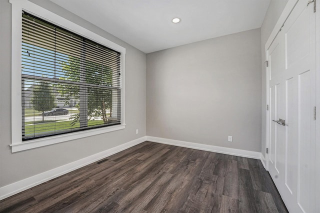 8275 Woodhaven Dr SW, Byron Center, MI 49315 - spare room featuring dark wood-type flooring and recessed lighting