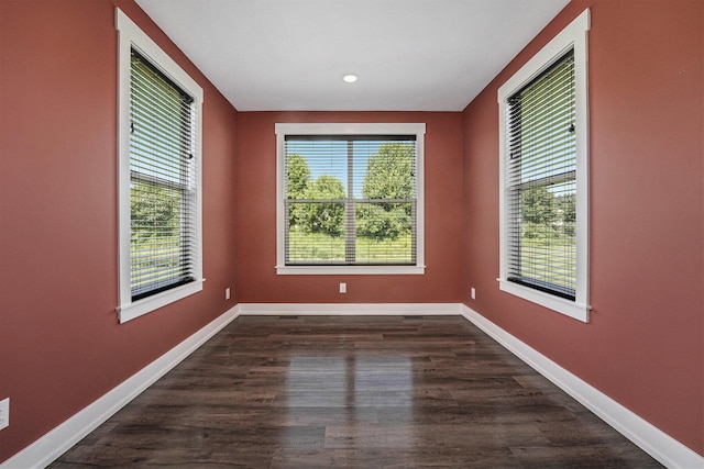 8275 Woodhaven Dr SW, Byron Center, MI 49315 - spare room with baseboards and dark wood finished floors