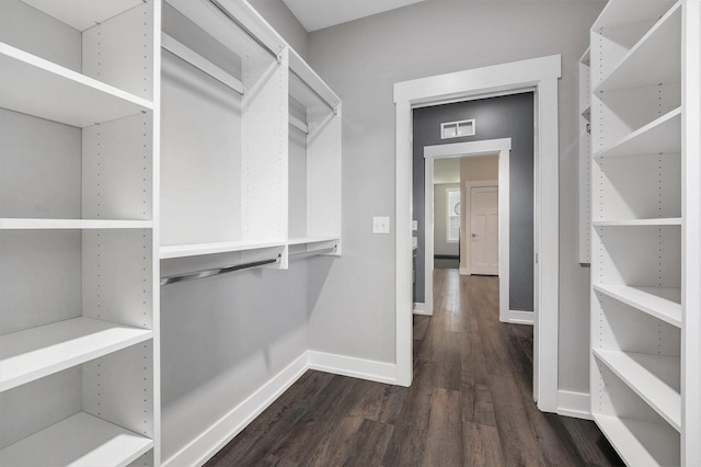 8275 Woodhaven Dr SW, Byron Center, MI 49315 - walk in closet with wood finished floors