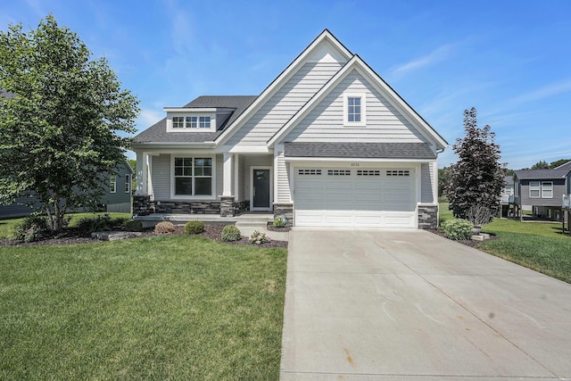 8275 Woodhaven Dr SW, Byron Center, MI 49315 - craftsman-style home featuring concrete driveway, stone siding, a garage, and a front yard