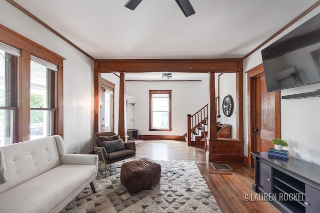 129 Dean St NE, Grand Rapids, MI 49505 - living area featuring ceiling fan, dark wood-style floors, and ornamental molding