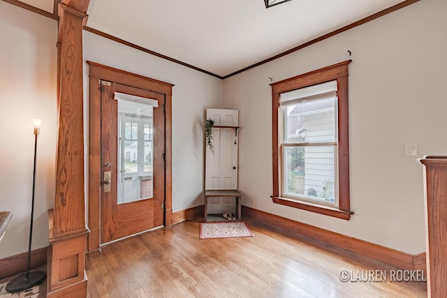 129 Dean St NE, Grand Rapids, MI 49505 - foyer entrance featuring wood finished floors and ornamental molding
