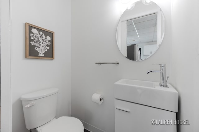 129 Dean St NE, Grand Rapids, MI 49505 - half bathroom with vanity and a paneled ceiling