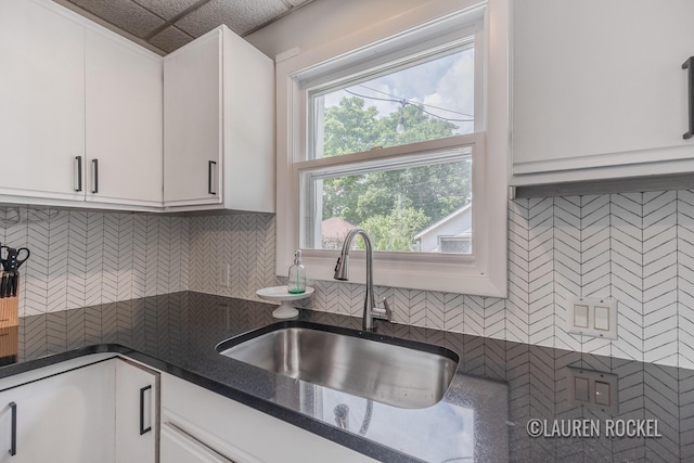 129 Dean St NE, Grand Rapids, MI 49505 - kitchen with white cabinets and tasteful backsplash