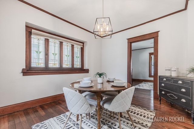 129 Dean St NE, Grand Rapids, MI 49505 - dining room featuring ornamental molding, a chandelier, and wood finished floors