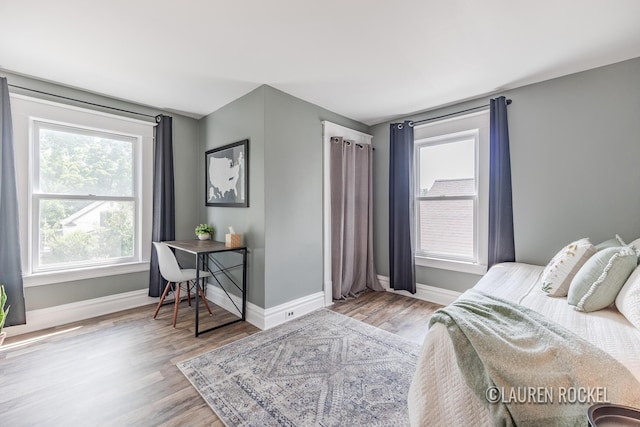 129 Dean St NE, Grand Rapids, MI 49505 - bedroom featuring wood finished floors and an office area